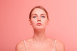 © primipil - Close up portrait of young beautiful caucasian woman with blue eyes looking to camera on pink background.