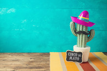 Cinco De Mayo Holiday Background With Mexican Cactus And  Party Sombrero Hat On Wooden Table
