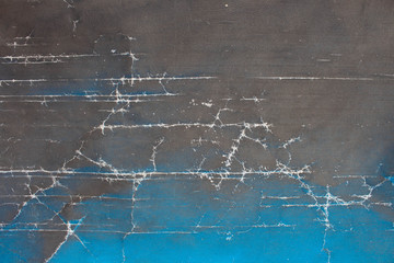 Vintage background with cracks and gradient from black to blue.