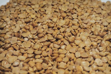 Poster - Сhopped dried peas background. Macro view.