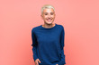 © luismolinero - Teenager girl with white short hair over pink wall laughing