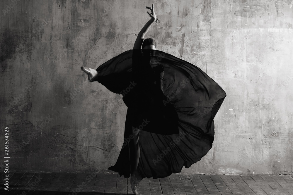 Ballerina in ballroom. Ballet dancer in studio. Black and white monochrome. - obrazy, fototapety, plakaty 