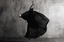 Ballerina In Ballroom. Ballet Dancer In Studio. Black And White Monochrome.