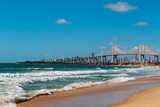 Fototapeta Morze - The Natal (Brazil) skyline and Newton Navarro bridge view from Redinha beach.