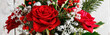 Christmas floral arrangement with roses and other plants, panorama.