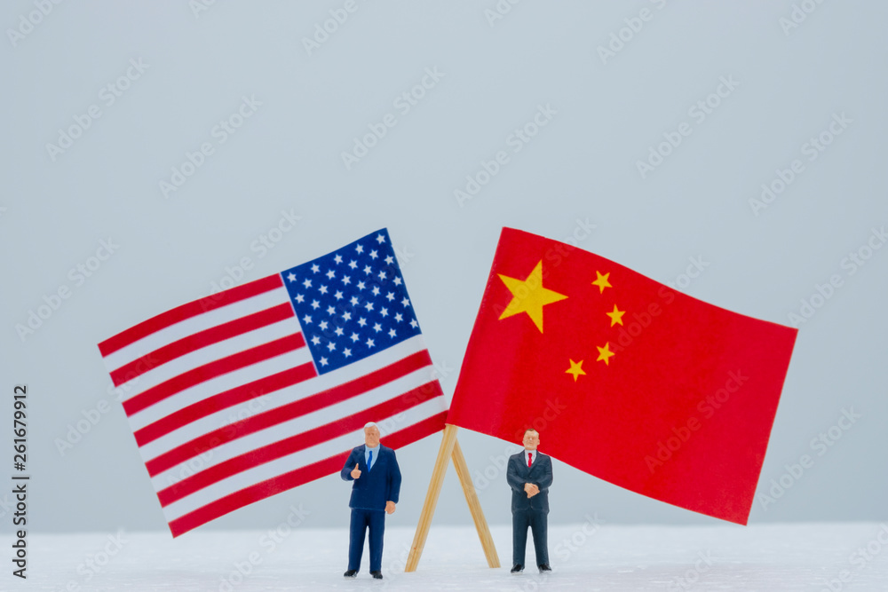 2 Miniature figure with USA and China flags. Its is symbol for tariff ...