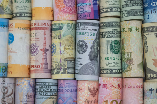 Cuadros en Lienzo Closeup rolled of variety banknote around the world
