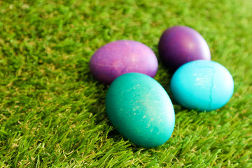 Blue and azure easter eggs in the green grass