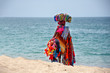 African woman sell traditional costume cloths on the beach, zungueira - Luanda, Angola, Africa