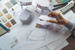 © Chaosamran_Studio - architect design working drawing sketch plans blueprints and making architectural construction model in architect studio