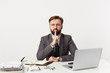 © timtimphoto - Serious volitional calm emotionless bearded man in business suit, showing silence gesture, asks to keep secret privacy stay quiet putting fore finger on the lips, isolated over white background