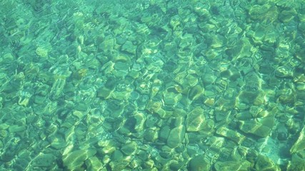 Poster - Clean transparent elegant emerald water wave in slow motion of Baikal lake in Olkhon island, Irkutsk Russia