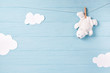 Baby boy background with white teddy bear toy on a clothesline and clouds