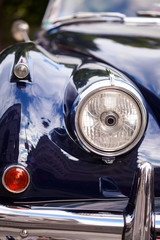 Wall Mural - Front part with headlight of British retro car headlight