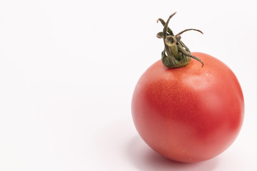 Wall Mural - Close up red tomatoes on isolate white background.Selective focus red tomatoes.