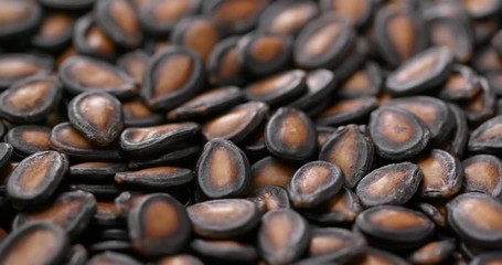 Canvas Print - Stack of dry black melon seed for lunar new year