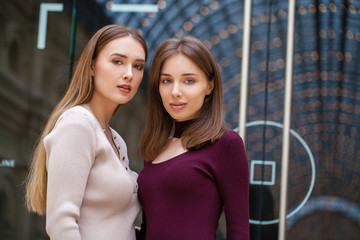 Two brunette young women, indoor