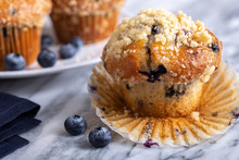 Blueberry Muffin With Berries On A Marble Surface