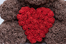 Toys With A Red Heart Of Roses. Feast Of St. Valentine, Love. A Brown Bear Holds A Red Heart.