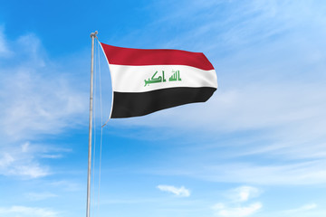 Wall Mural - Iraq flag over blue sky background