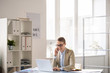© pressmaster - Lady manager solving work issues