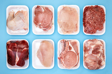 Wall Mural - Variety of raw meat in foam packaging trays