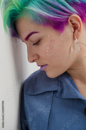 Young Beautiful Woman With Dyed Blue And Green Hair Pixie