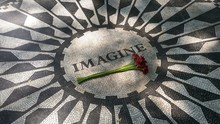 Black And White Imagine Mosaic For Memory John Lennon. Red Flower. Strawberry Fields In Central Park. New York City. USA