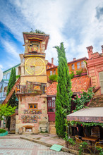Beautiful Clock Tower Of Puppet Theater Rezo Gabriadze In Historical Center Of Old Tbilisi, Georgia