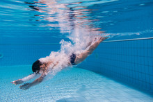 Boy Dive In Swimming Pool