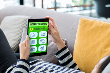 Aufkleber - Internet banking concpet.Woman lying down on sofa using tablet mobile app for pay bill online at home.digital technology lifestyle