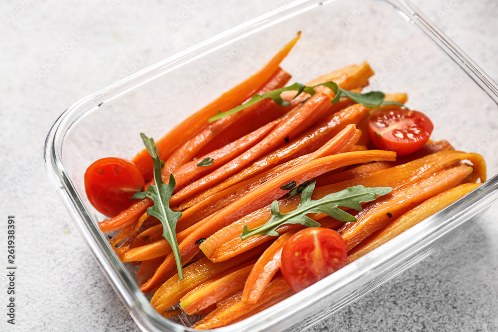 Dish with tasty cooked carrot on table