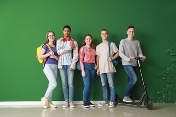 Canvas Print - Group of teenagers near color wall