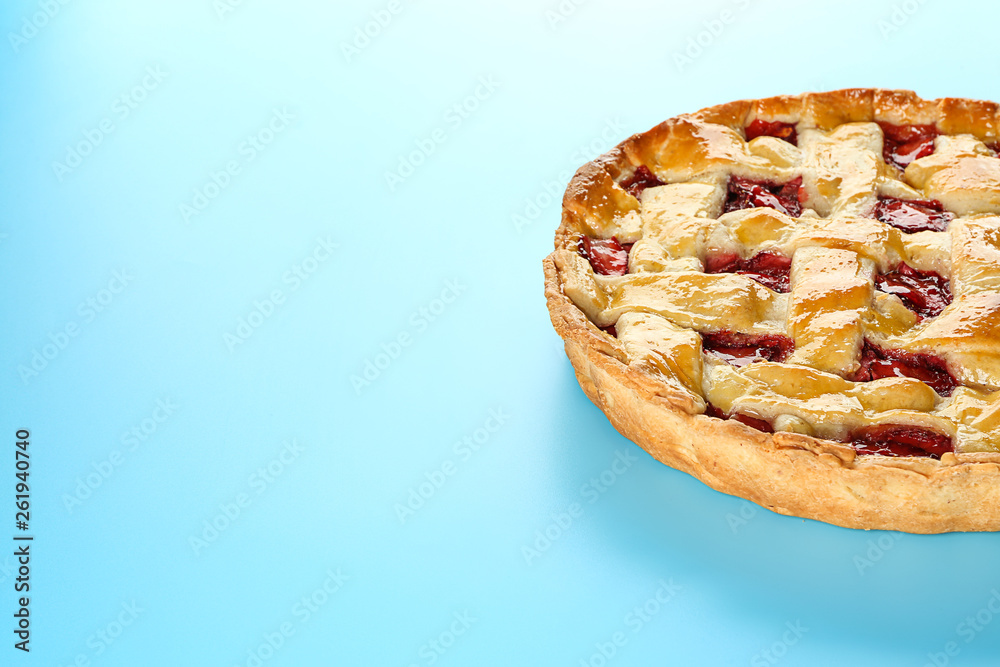 Tasty strawberry pie on color background