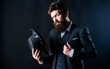 Elegant and stylish hipster. Retro fashion hat. Man with hat. Vintage fashion. Man well groomed bearded gentleman on dark background. Male fashion and menswear. Formal suit classic style outfit