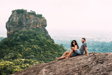 A Couple In Love On A Rock Admires The Beautiful Views. Boy And Girl On The Rock. A Couple In Love Travels. Couple In Sri Lanka. Honeymoon In Asia. Man And Woman In Sigiriya. Couple In The Mountains