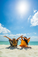 Sticker - Woman enjoying her holidays on a transat at the tropical beach