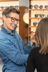 Wall Mural - woman in a eyewear store