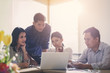 © only_kim - Businesspeople discuss a project ;A woman sitting at the computer shows infographics to partners; An example of good relations at work