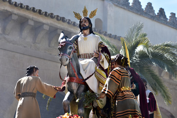 Wall Mural - Jesus statue in Palm Sunday procession depicting Jesus and his triumphal entrance into Jerusalem, Cordoba, Spain