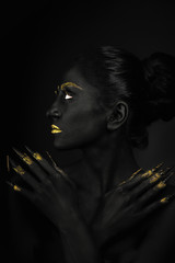 Fashion portrait in black and gold! Amazing nails