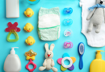 Wall Mural - flat lay composition with baby accessories on color background