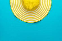 Top View Of Yellow Hat On Blue Background With Copy Space
