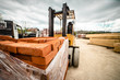 © Miljan Živković - Fork lifter carry construction material clay bricks at the warehouse building site