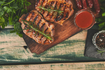 Wall Mural - Steak pork grill on wooden cutting board