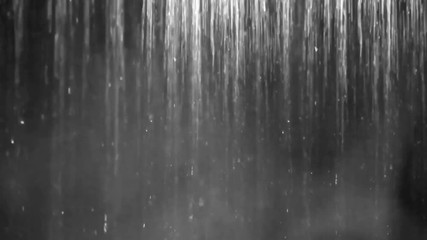 Wall Mural - waterfall seamless loop isolated. hot shower with steam and black background