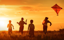Children With A Kite At Sunset