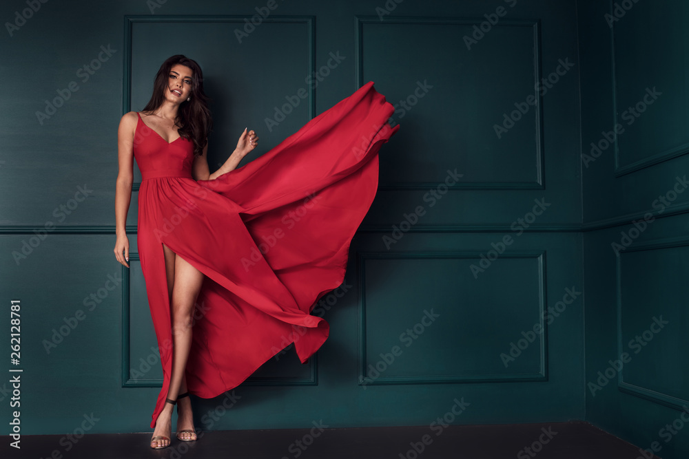 Fashion lady in red maxi dress. - obrazy, fototapety, plakaty 