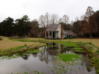 Cabin and barn at LSU Rural Life Museum, an outdoor museum of Louisiana history, Baton Rouge, Louisiana, USA