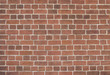 Red brick wall close-up. Brick wall background.